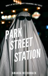 A ghost in a white sheet, wearing sunglasses, stands in an out of focus city at night. Text in the middle of the images reads Park Street Station
